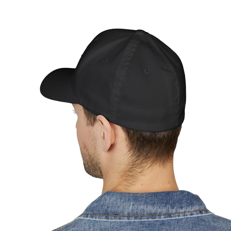 DailyThreadCo. black structured flexfit cap worn by a man in a denim jacket, showing a clean back profile.