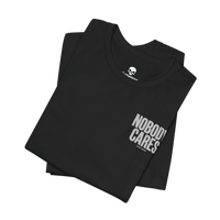 DailyThreadCo. black cotton graphic t-shirt with Nobody Cares Work Harder text print, folded on a black background.