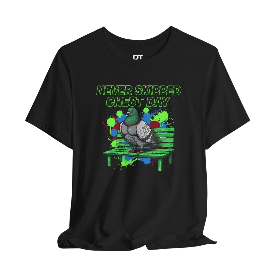 DailyThreadCo. black cotton t-shirt with a graphic of a muscular pigeon on a green park bench, text reads "NEVER SKIPPED CHEST DAY".