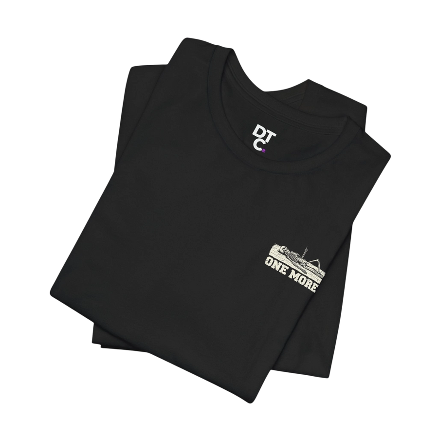 DailyThreadCo. black 100% Airlume cotton t-shirt with a distressed skeleton graphic and "ONE MORE" text on the chest.