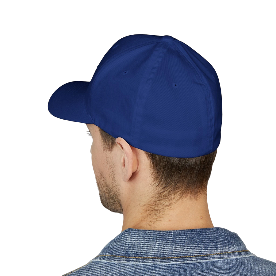 DailyThreadCo. blue structured Flexfit cap worn by a man in a denim jacket, featuring a classic mid-profile design.