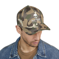 DailyThreadCo. camo Flexfit cap with distressed skull embroidery and text on a man wearing a denim jacket.