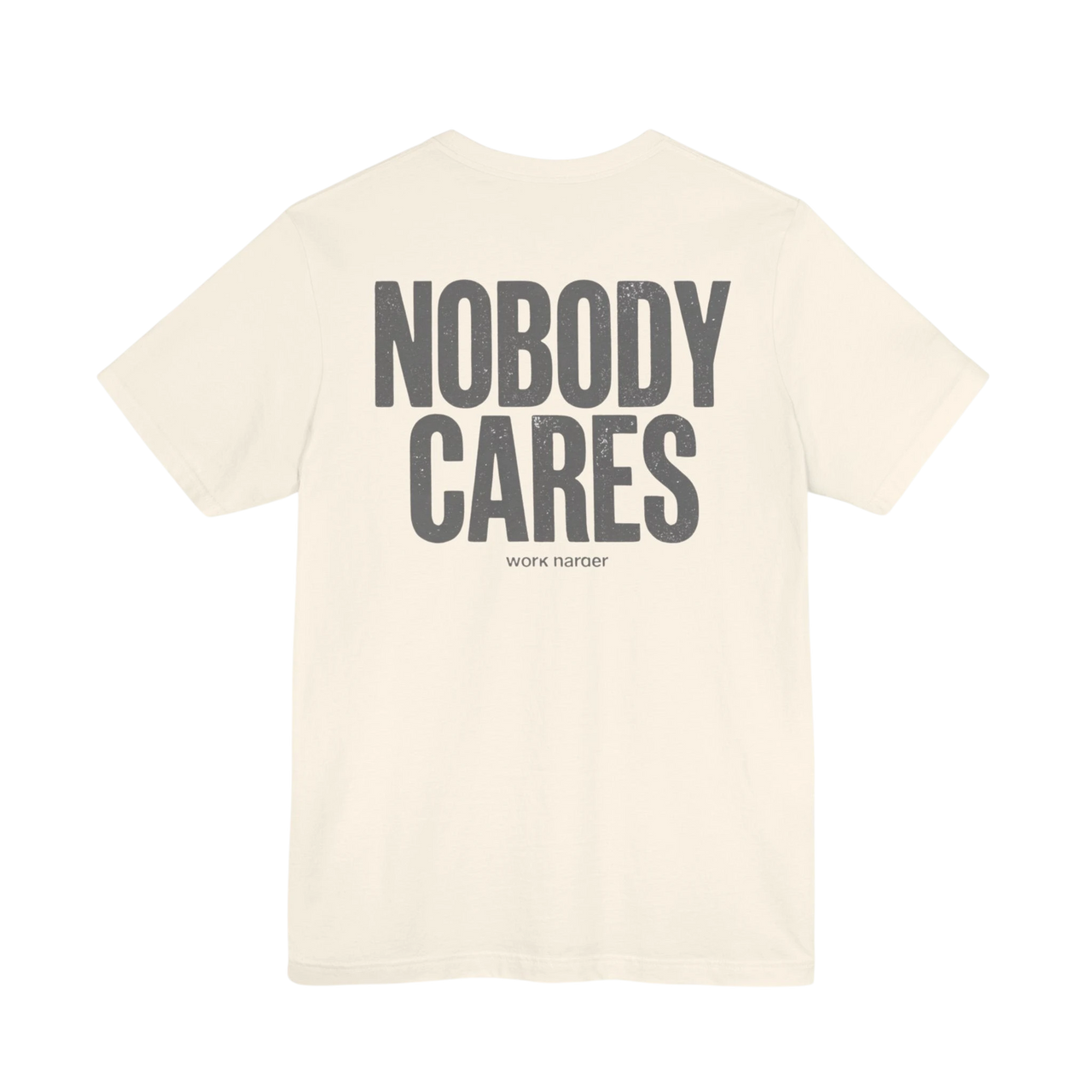 DailyThreadCo. cream cotton graphic t-shirt featuring Nobody Cares text on the back in a distressed grey font.
