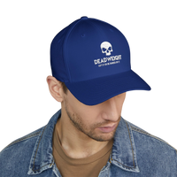 DailyThreadCo. blue structured Flexfit cap with white distressed skull embroidery and text on a model.