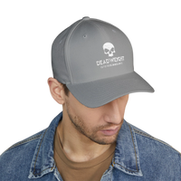 DailyThreadCo. grey flexfit cap with distressed skull embroidery and text on a man wearing a denim jacket.