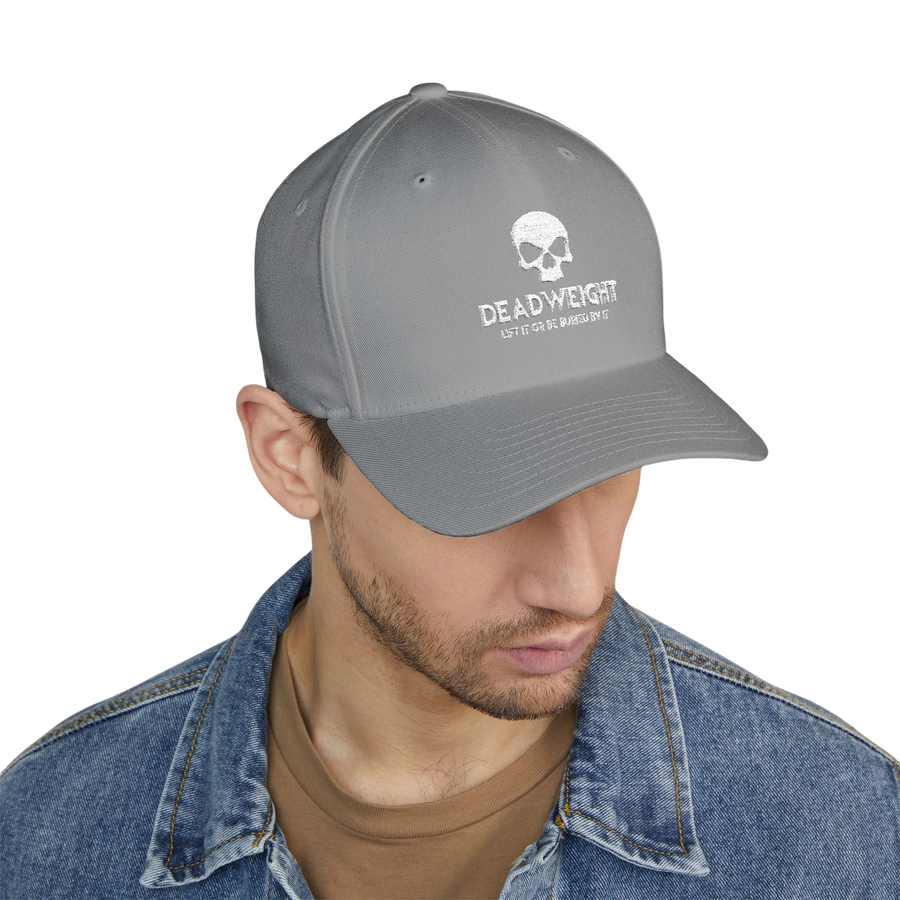 DailyThreadCo. grey flexfit cap with distressed skull embroidery and text on a man wearing a denim jacket.