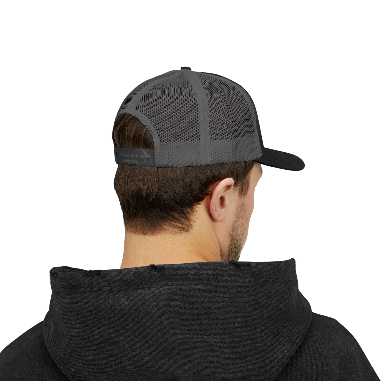 DailyThreadCo. Deadweight skull trucker cap with breathable mesh back and adjustable snapback worn by a man.