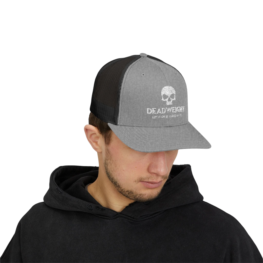 DailyThreadCo. grey and black trucker cap with skull logo, featuring a structured front and breathable mesh back.