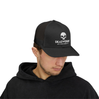 DailyThreadCo. black trucker cap with white skull logo, mesh back, and adjustable snapback for gym and fitness wear.