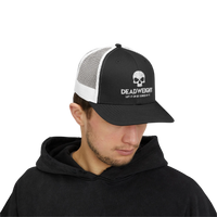 DailyThreadCo. black and white trucker cap with skull logo, worn by a man in a black hoodie for gym and fitness.