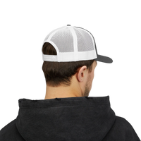 DailyThreadCo. Deadweight skull trucker cap with white mesh back and adjustable snapback worn by a man in a hoodie.