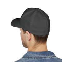 DailyThreadCo. structured flexfit cap in dark grey with a curved visor, worn by a man in a denim jacket.