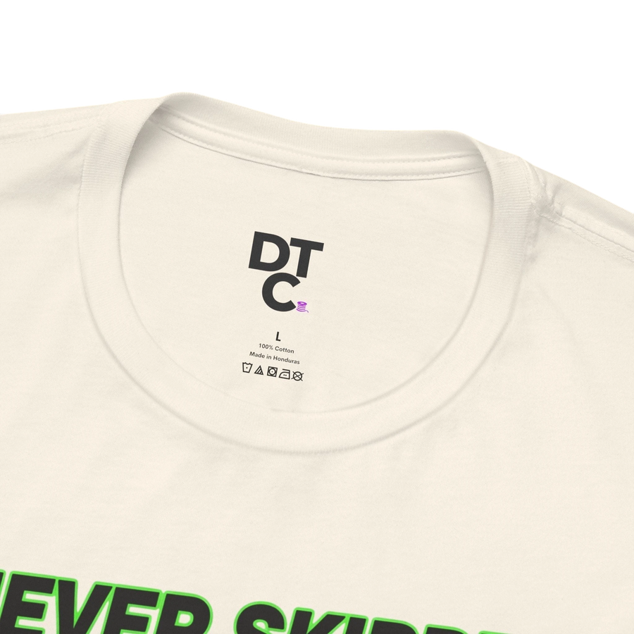 DailyThreadCo. cream 100% cotton t-shirt with "Never Skipped Chest Day" graphic print and pigeon illustration.
