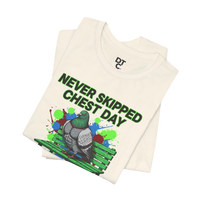 DailyThreadCo. cream cotton t-shirt with a graphic of a muscular pigeon on a green bench, surrounded by colorful paint splatters and the text 