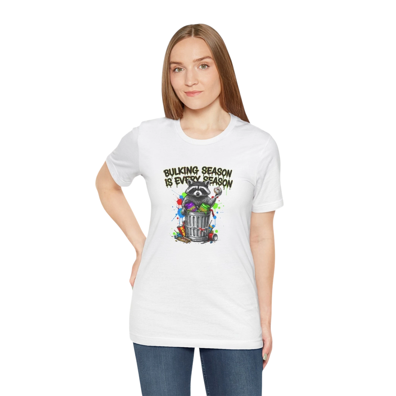 DailyThreadCo. white 100% cotton t-shirt with a graphic of a raccoon in a trash can, surrounded by colorful paint splatters and the text "BULKING SEASON IS EVERY SEASON".