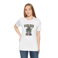 DailyThreadCo. white 100% cotton t-shirt with a graphic of a raccoon in a trash can, surrounded by colorful paint splatters and the text 