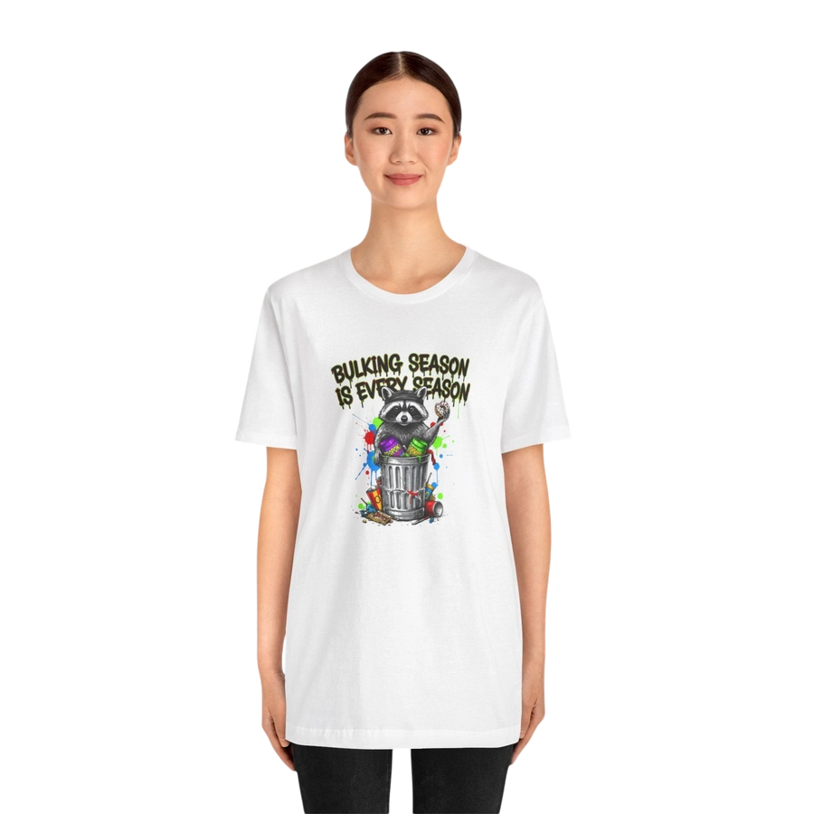 DailyThreadCo. white 100% cotton t-shirt with a graphic of a raccoon in a trash can with the text "BULKING SEASON IS EVERY SEASON".