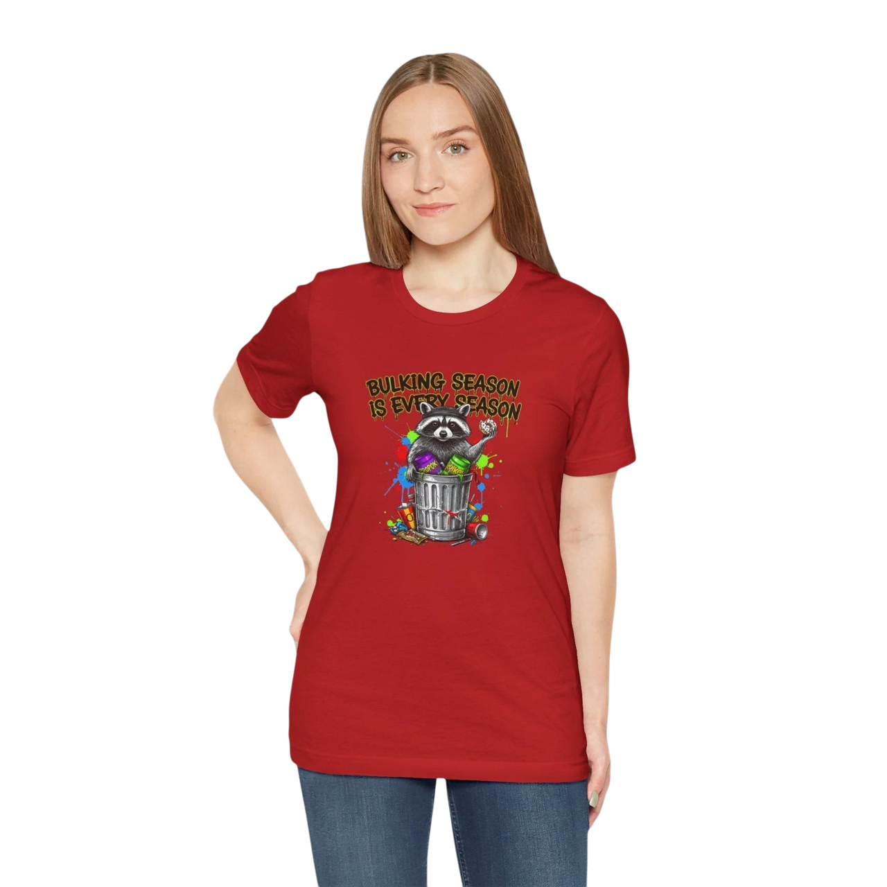 DailyThreadCo red 100% cotton t-shirt with a graphic of a raccoon in a trash can with colorful paint splatters and the text "BULKING SEASON IS EVERY SEASON".