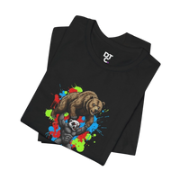 DailyThreadCo black 100% cotton t-shirt with a graphic of a honey badger lifting a bear, set against a colorful paint splash background.