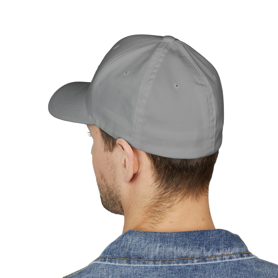 DailyThreadCo. grey structured Flexfit cap worn by a man, featuring a mid-profile design and curved visor.