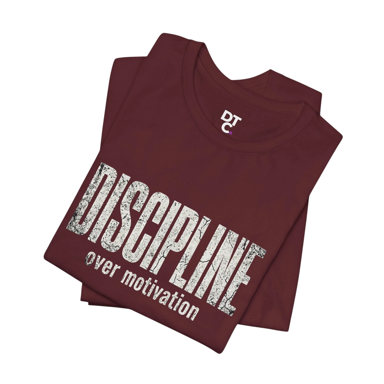 DailyThreadCo. maroon cotton t-shirt with distressed white text reading "DISCIPLINE over motivation".