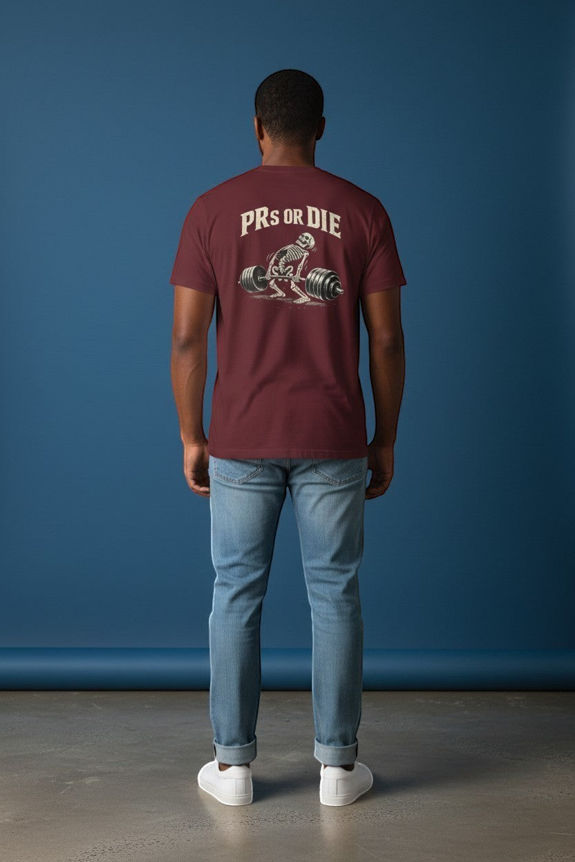DailyThreadCo. maroon 100% cotton t-shirt with skeleton deadlifting graphic and "PRs or Die" text on back.
