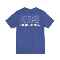 DailyThreadCo. blue heathered cotton t-shirt featuring a motivational typographic back print about building in silence.