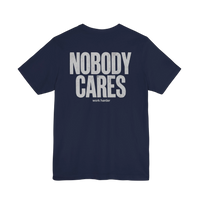 DailyThreadCo. navy blue cotton graphic t-shirt featuring Nobody Cares Work Harder text on the back.