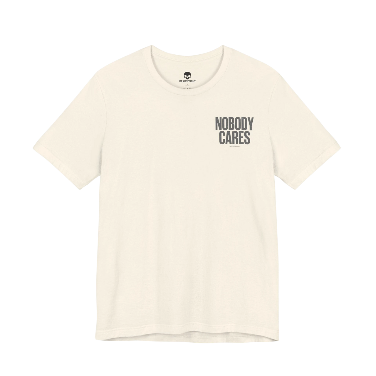DailyThreadCo. Nobody Cares graphic tee in cream cotton with black chest text, featuring a crew neck and retail fit.