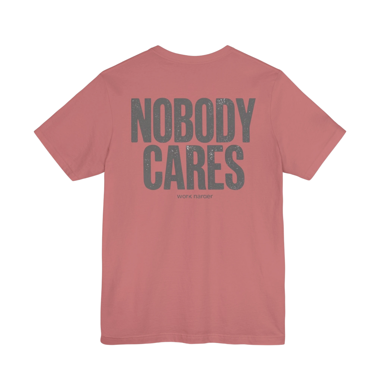 DailyThreadCo. Dusty rose 100% cotton t-shirt with distressed grey "NOBODY CARES" graphic and "work harder" text.