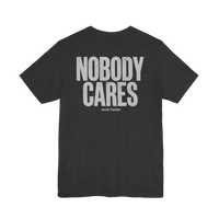DailyThreadCo. dark grey cotton graphic tee featuring Nobody Cares Work Harder text on the back.