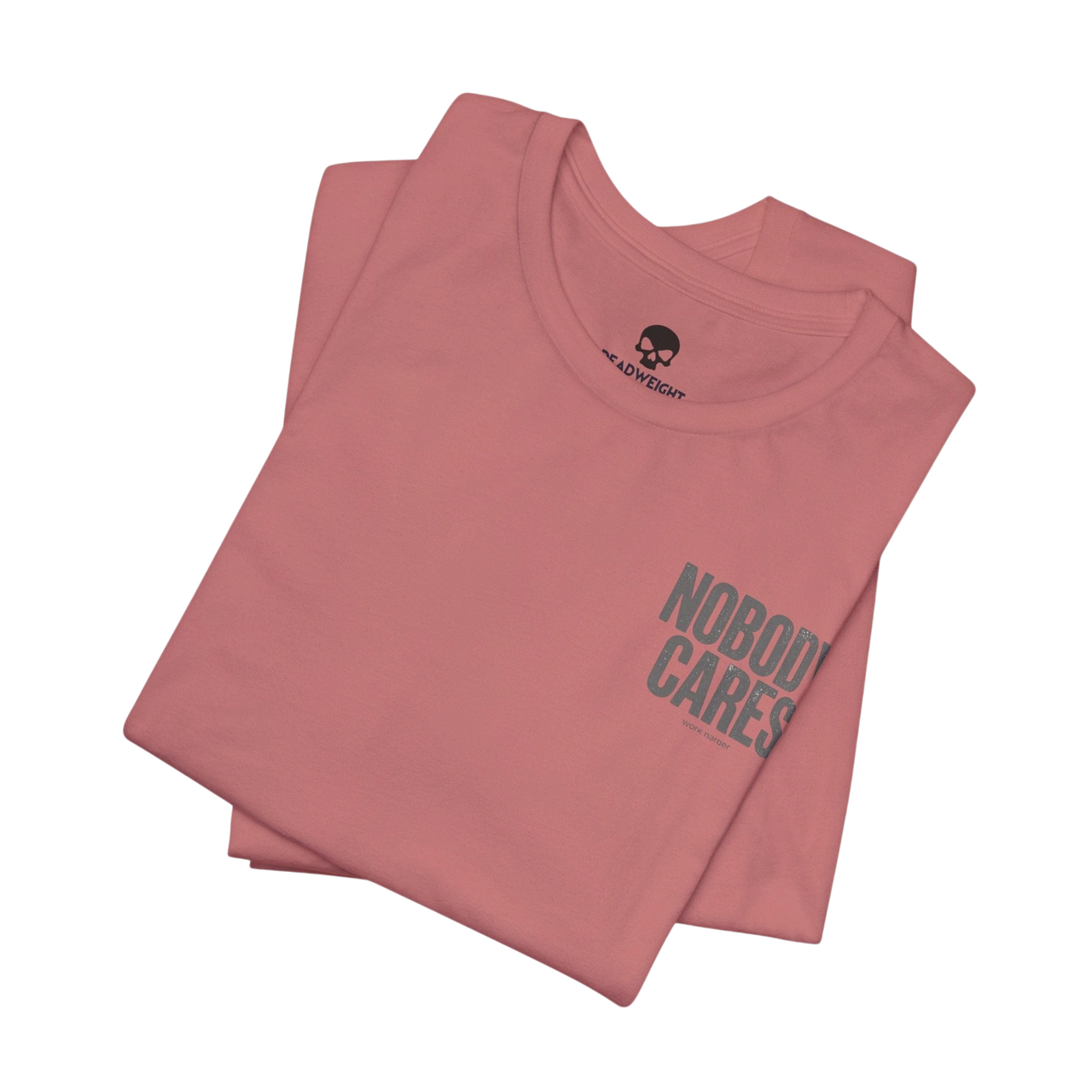 DailyThreadCo. Nobody Cares graphic tee in dusty pink cotton with a crew neck and minimalist front text design.