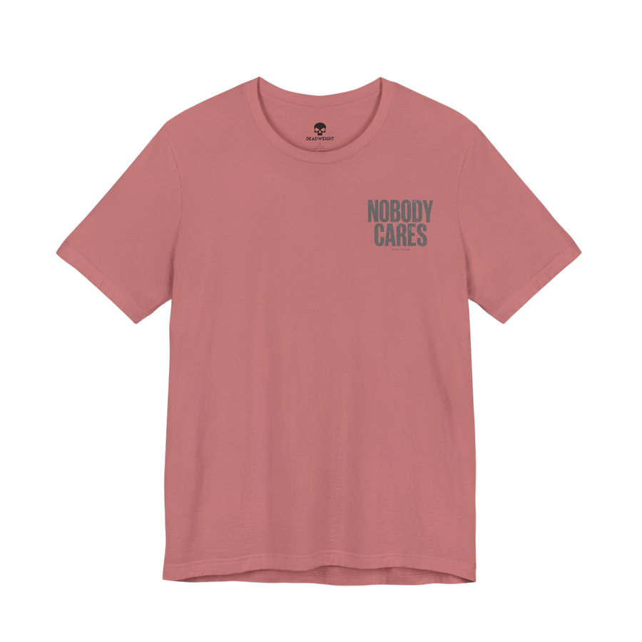 DailyThreadCo. Nobody Cares graphic tee in dusty pink cotton with a crew neckline and minimalist front text design.