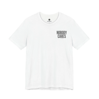 DailyThreadCo. white graphic t-shirt with Nobody Cares text print on the chest, made from lightweight cotton.