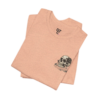 DailyThreadCo. peach-colored cotton t-shirt with a small, hand-drawn skull and rose graphic on the left chest.