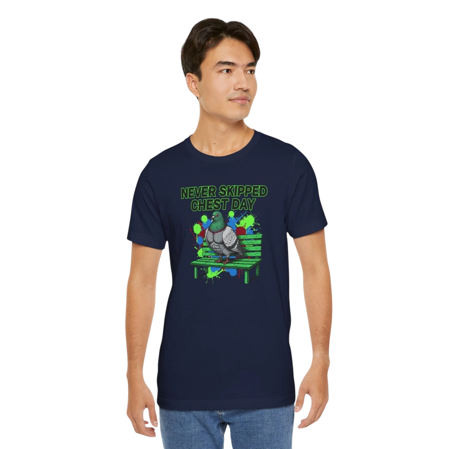 DailyThreadCo. navy blue 100% cotton t-shirt with a graphic print of a pigeon on a park bench and the text "NEVER SKIPPED CHEST DAY".