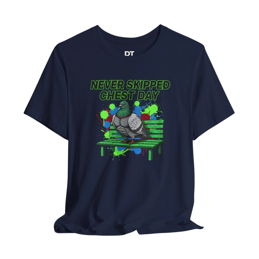 DailyThreadCo. navy blue 100% cotton t-shirt with a graphic print of a muscular pigeon on a park bench. Text reads "NEVER SKIPPED CHEST DAY" in neon green.