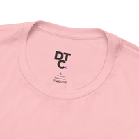 DailyThreadCo. light pink 100% cotton crew neck t-shirt with 'Zero Given' graphic and care instructions tag.