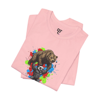 DailyThreadCo. pink 100% cotton t-shirt with graphic of a honey badger lifting a bear, set against a colorful paint splash background.