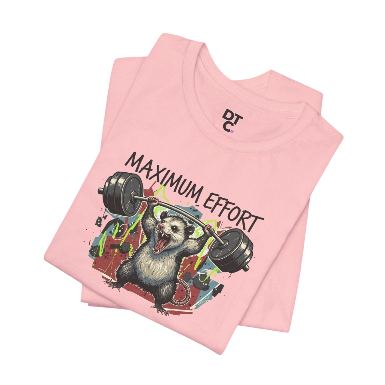 DailyThreadCo. pink 100% cotton t-shirt with a graphic of a possum lifting a barbell and the text "MAXIMUM EFFORT".