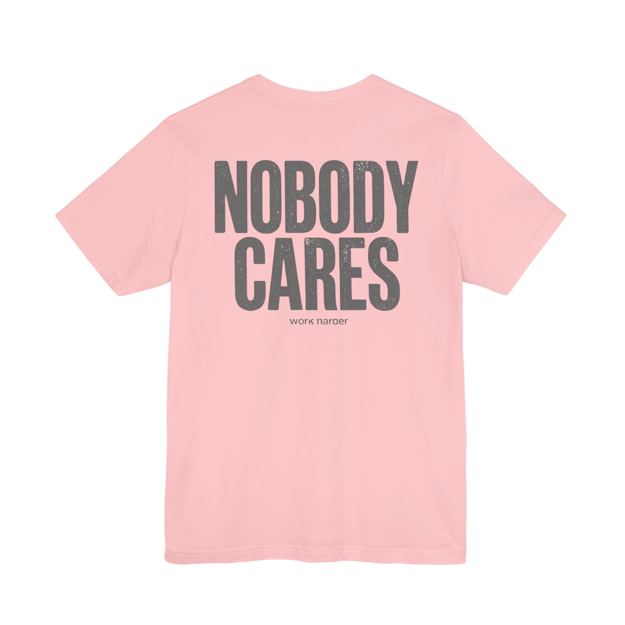 DailyThreadCo. pink cotton graphic t-shirt with Nobody Cares text printed on the back in a distressed grey font.