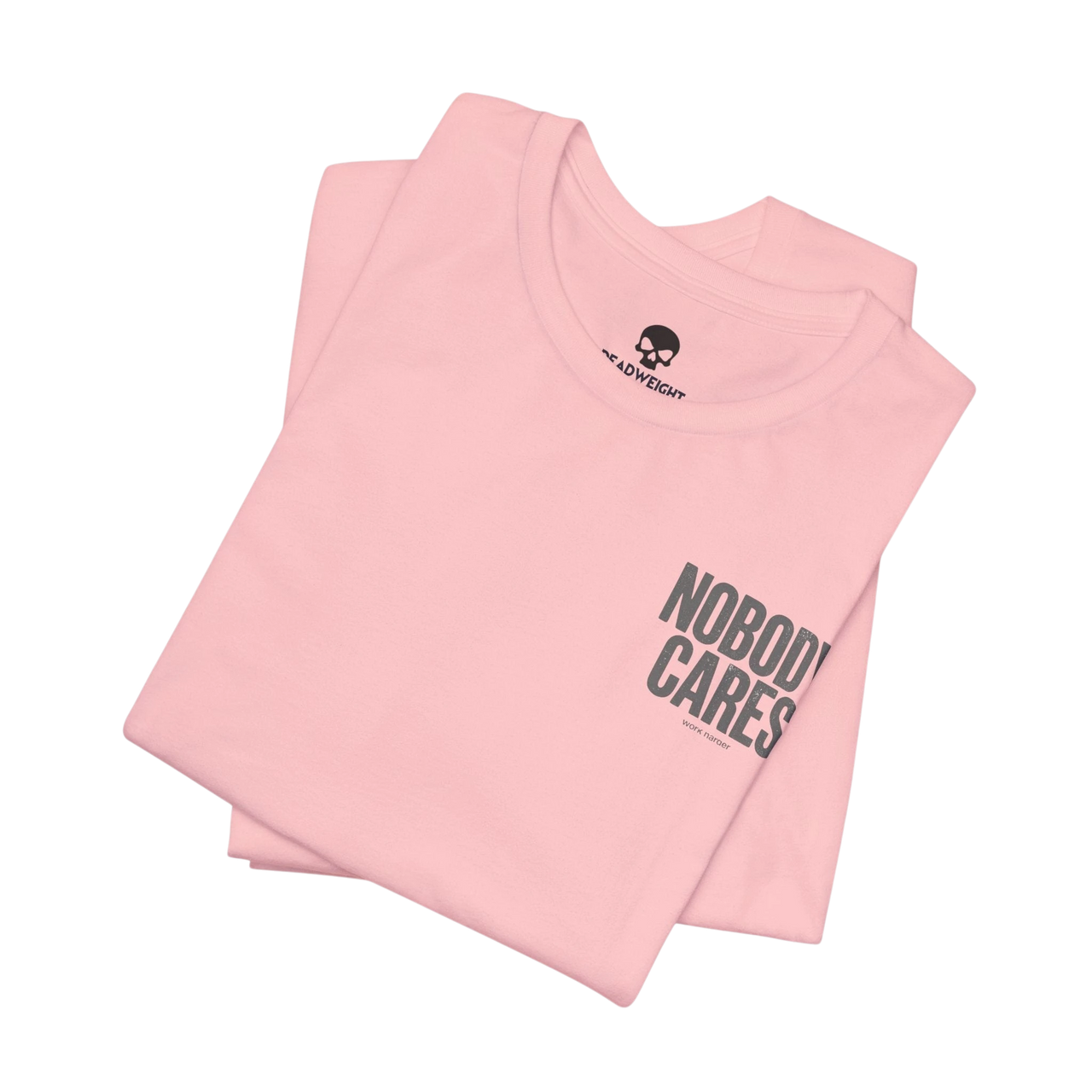 DailyThreadCo. light pink cotton graphic t-shirt featuring Nobody Cares text print, folded with crew neck.