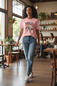 DailyThreadCo. pink cotton t-shirt with a cartoon skeleton running, holding coffee and a briefcase, with the text 