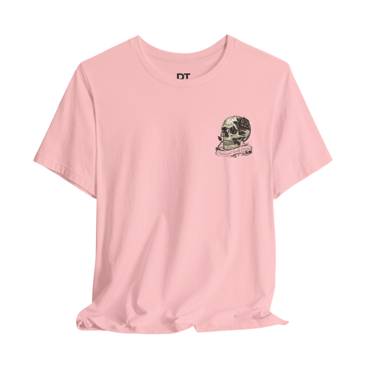 DailyThreadCo. pink 100% cotton t-shirt with a small graphic of a skull and rose over the heart, featuring the text "Pain is just beauty growing".