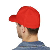 DailyThreadCo. red structured Flexfit cap with a mid-profile fit and curved visor worn by a man.