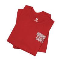 DailyThreadCo. red cotton graphic t-shirt with Nobody Cares print, featuring a crew neck and retail fit.