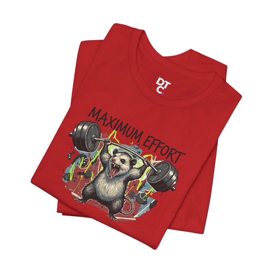 DailyThreadCo red 100% cotton t-shirt with a graphic of a possum lifting a barbell and the text "MAXIMUM EFFORT".