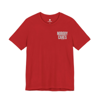 DailyThreadCo. red cotton graphic t-shirt featuring Nobody Cares text on the chest, crew neck, and retail fit.