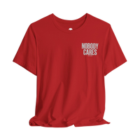 DailyThreadCo. red graphic t-shirt with Nobody Cares text print on the chest, made from soft lightweight cotton.
