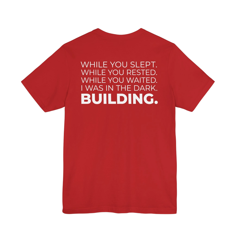 DailyThreadCo. red cotton motivational t-shirt featuring white typographic back print with the quote Building.